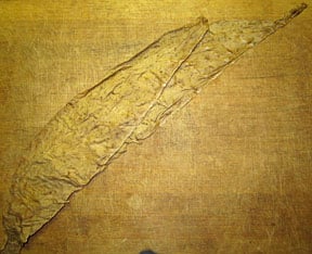 Binder toward the head is laid beneath the binder at the foot.