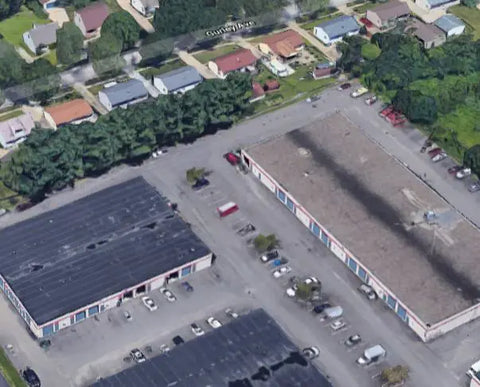 Aerial view of a commercial property with multiple buildings and parking lots.